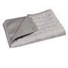 A gray cooling pet mat for dogs and cats, folded and displayed on a white background.