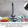 A black tube aerator is shown spraying bubbles into a fish tank filled with colorful aquarium gravel and fish.