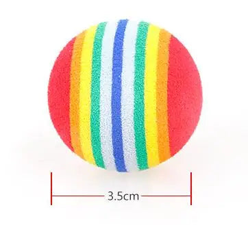 A spherical catnip chew toy with vertical stripes of red, orange, yellow, green, blue, and white.