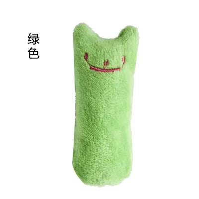 A bright lime green catnip chew toy plush with a smiling face.