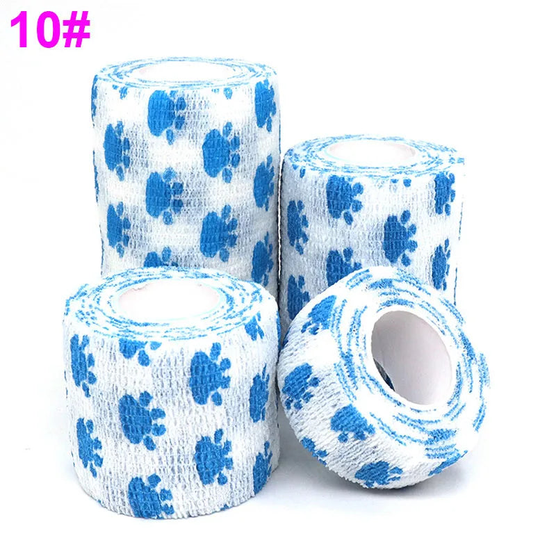 Rolls of blue and white printed self-adhesive elastic bandage tape