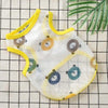 A white mesh vest with yellow trim and patterned designs is shown on a checkered surface.