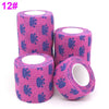 Rolls of pink printed self-adhesive elastic bandage tape in blue patterns