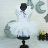 A black dress form displays a white sequined princess dog dress with a sheer tulle skirt against a light background.