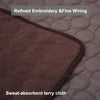 A close-up of a brown sweat-absorbent terry cloth pet mat with refined embroidery and fine wiring.