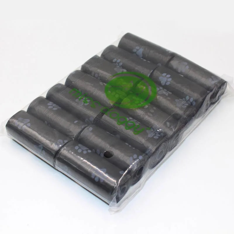 A pack of 14 rolls of paw print dog waste bags with a dispenser visible in clear plastic packaging.