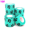 Roll of teal elastic bandage tape with black paw print pattern