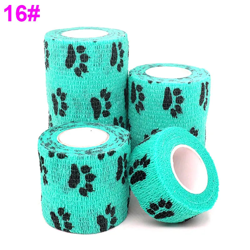 Roll of teal elastic bandage tape with black paw print pattern