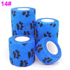 Four rolls of blue printed self-adhesive elastic bandage tape with black paw print designs
