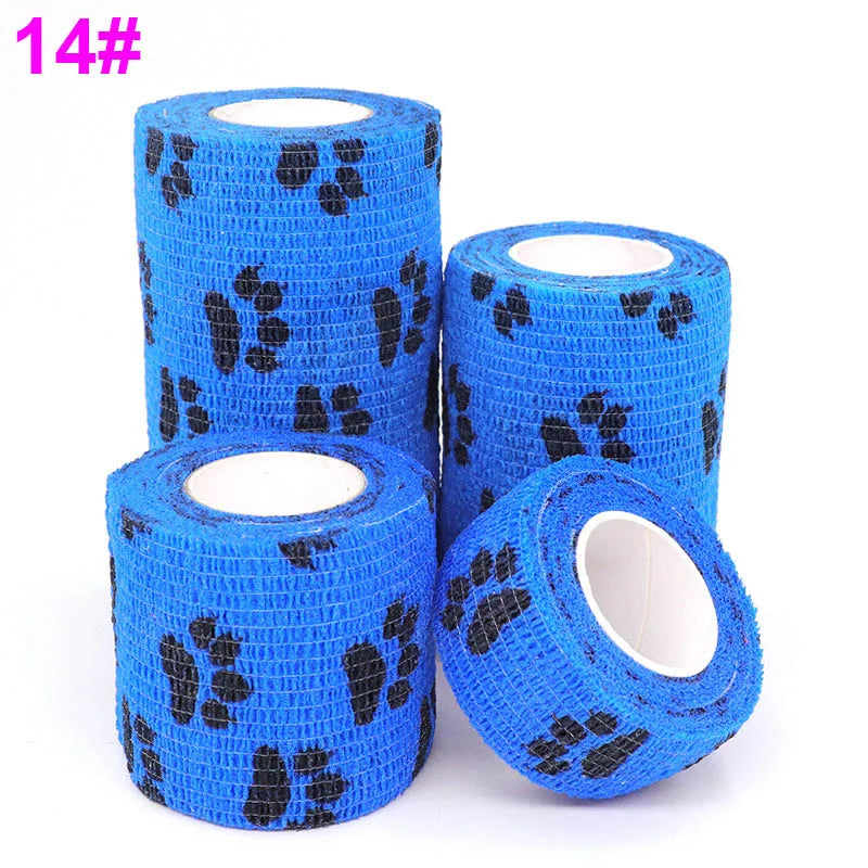 Four rolls of blue printed self-adhesive elastic bandage tape with black paw print designs