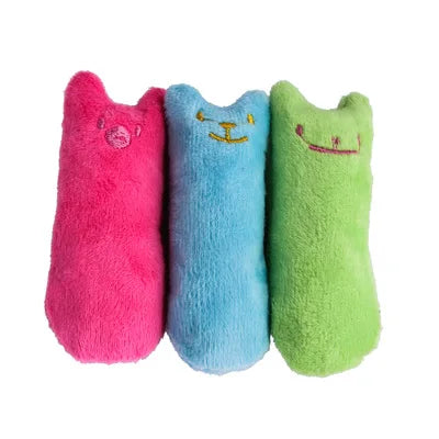 Three plush cat toys in pink, blue, and green with smiling faces.