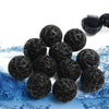 Black bio balls used for water filtration floating on blue water