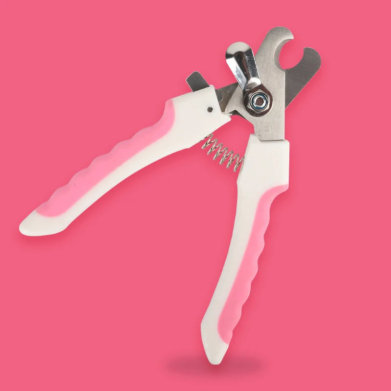 A pair of pink-handled stainless steel pet nail clippers for dogs and cats against a pink background.