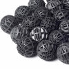 A pile of black aquarium bio balls used for water filtration.