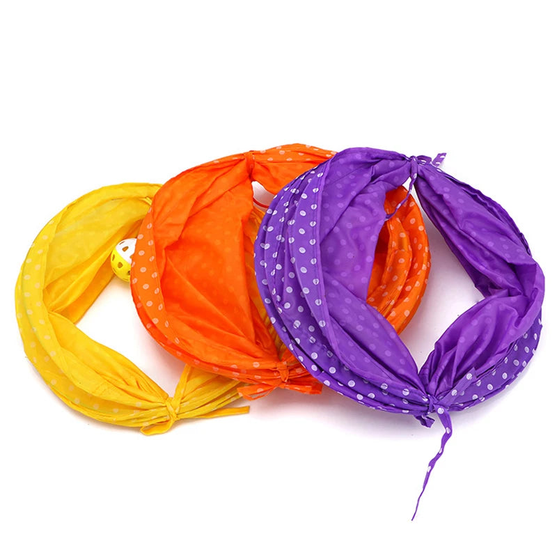 Collapsible cat tunnel play tube in orange and purple fabric with a ball