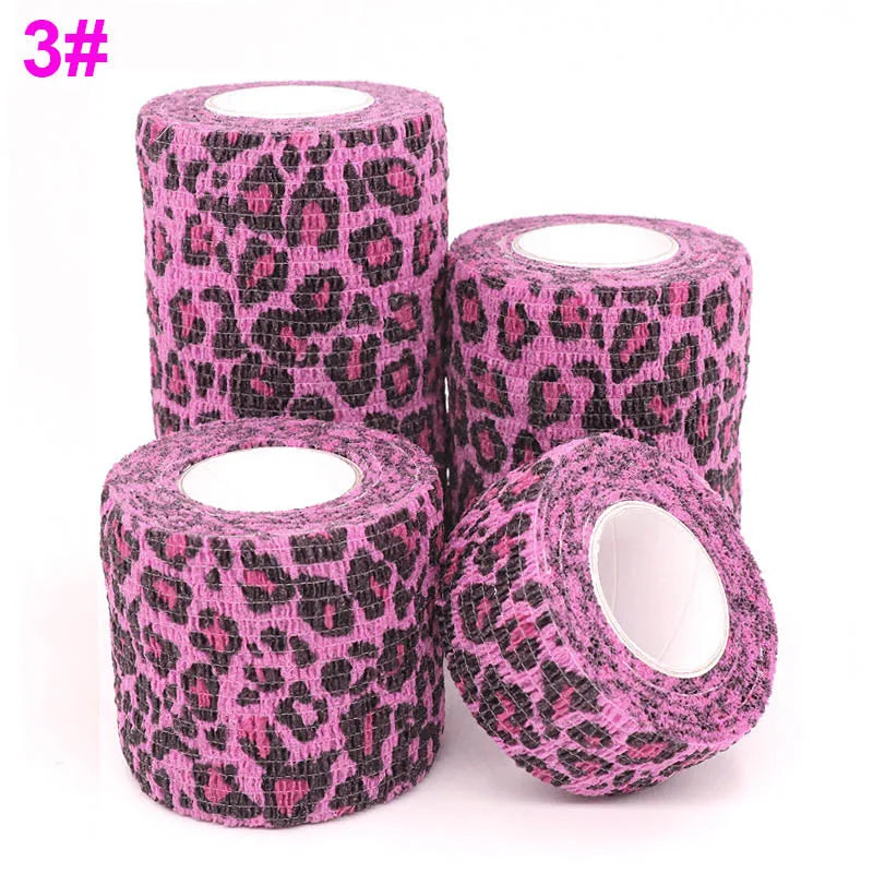 Rolls of pink and black leopard print self-adhesive elastic bandage tape.
