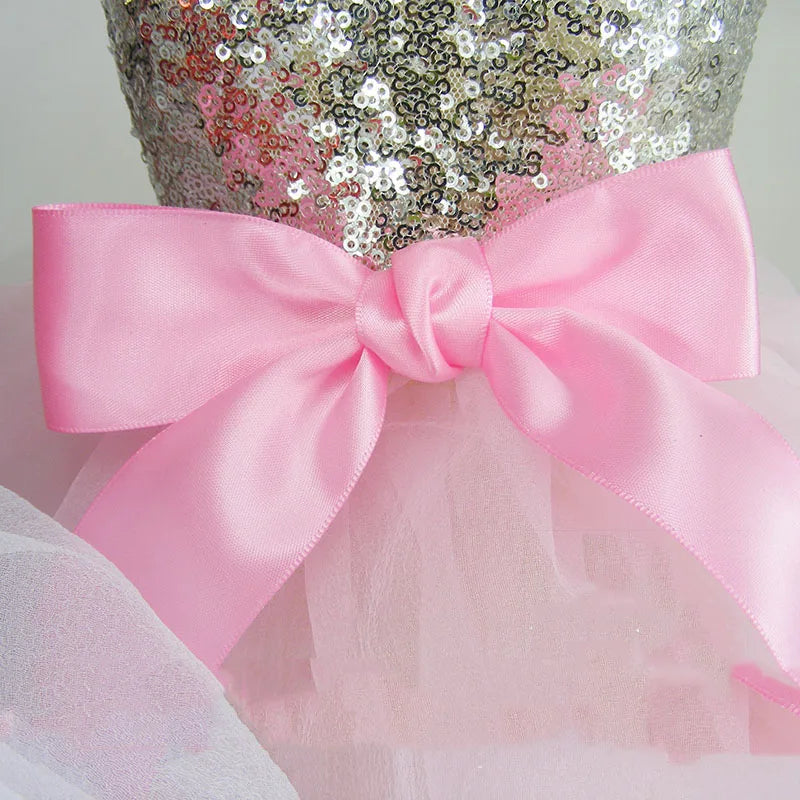 Pink sequined dog dress for puppies with a pink satin bow