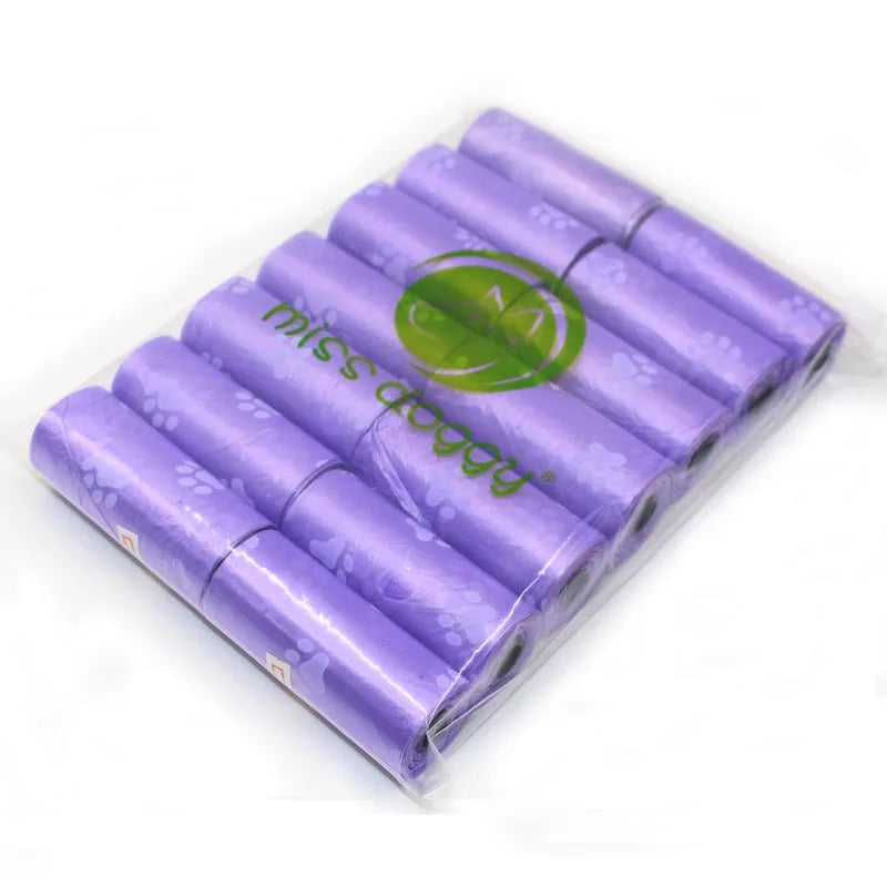 A pack of 14 purple paw print dog waste bags with a dispenser.
