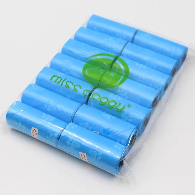 A pack of 14 blue paw print dog waste bags with a green dispenser visible in clear plastic packaging.
