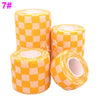 Roll of orange and white checkered printed self-adhesive elastic bandage tape
