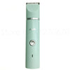 A light mint green quiet USB rechargeable pet grooming trimmer with a silver top and a round switch.