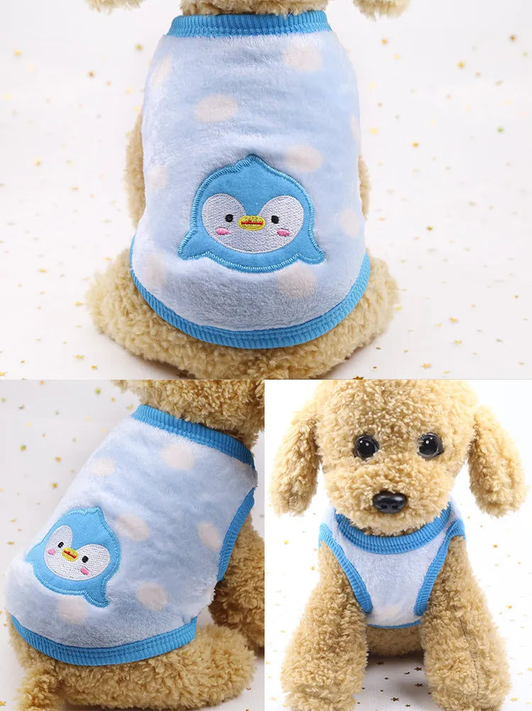 A light blue fleece puffer vest with a white penguin design for a small dog or cat.