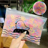 A clear plastic bag filled with colorful elastic hair bands and a graphic of a duck swimming in water.
