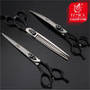 A set of professional pet grooming scissors and shears displayed on a dark background.