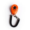 Orange pet training clicker with a black sensor attached to a metal chain and strap