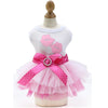 Pink and white elegant spring pet dress for dogs with a ruffled skirt and bow