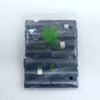 A package containing 14 rolls of dark gray paw print dog waste bags with a dispenser.