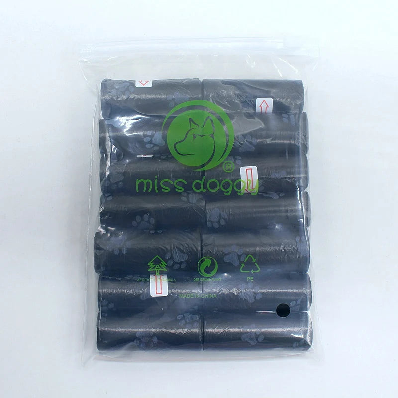 A package containing 14 rolls of dark gray paw print dog waste bags with a dispenser.