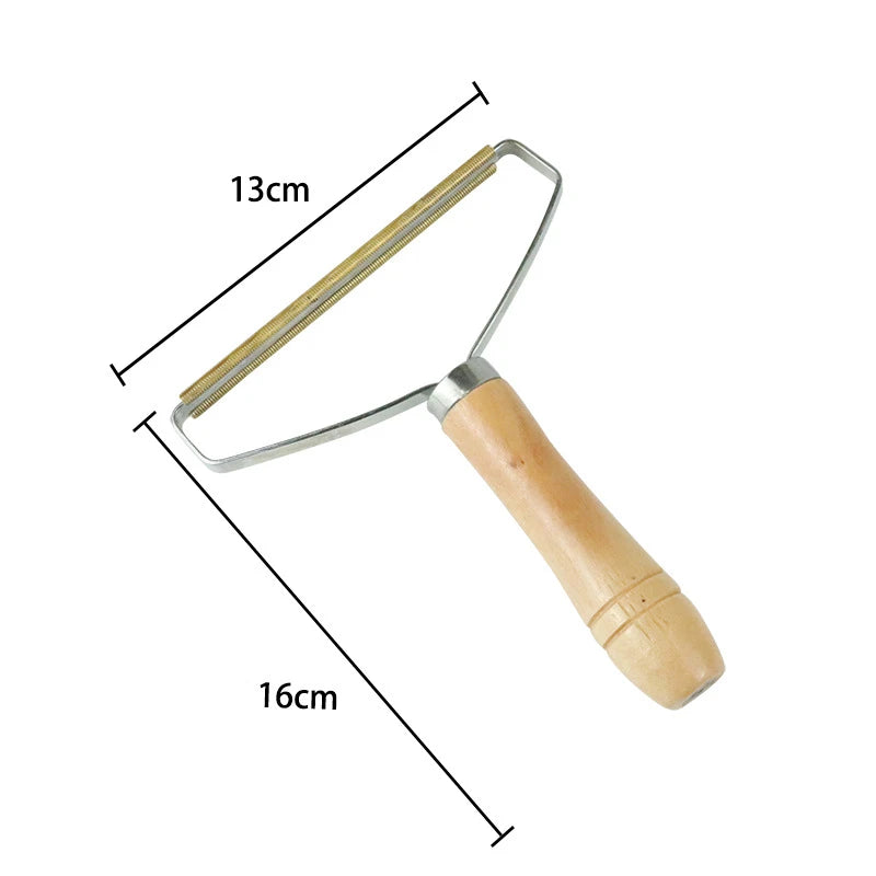 A portable lint and pet hair remover brush with a wooden handle and metal frame.