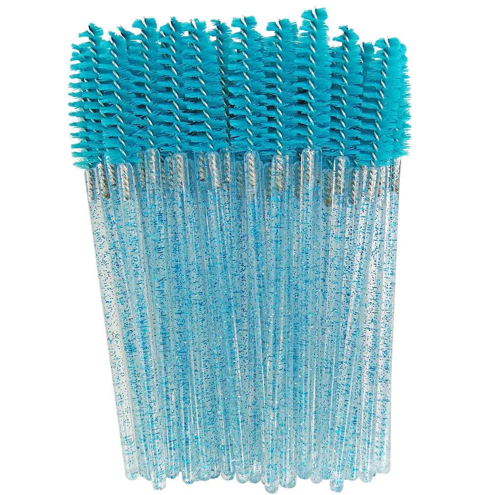 A bundle of blue disposable eyelash brushes with teal bristles and clear plastic handles.