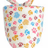 A cute cotton pet bandana with a pattern of paw prints in pink, yellow, and blue.