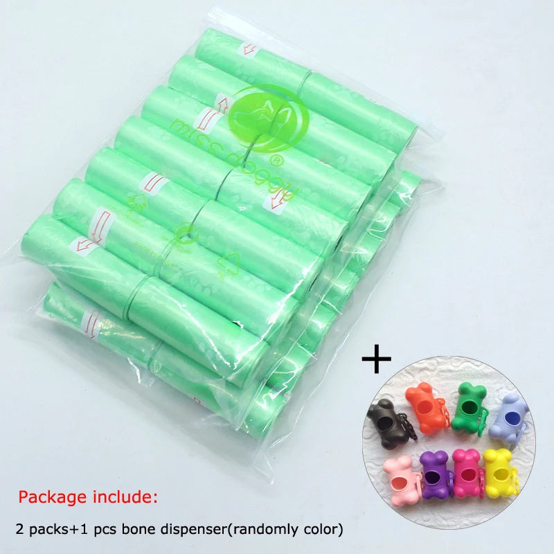 A package containing 2 packs of green dog waste bags and one randomly colored bone dispenser for pet waste disposal.