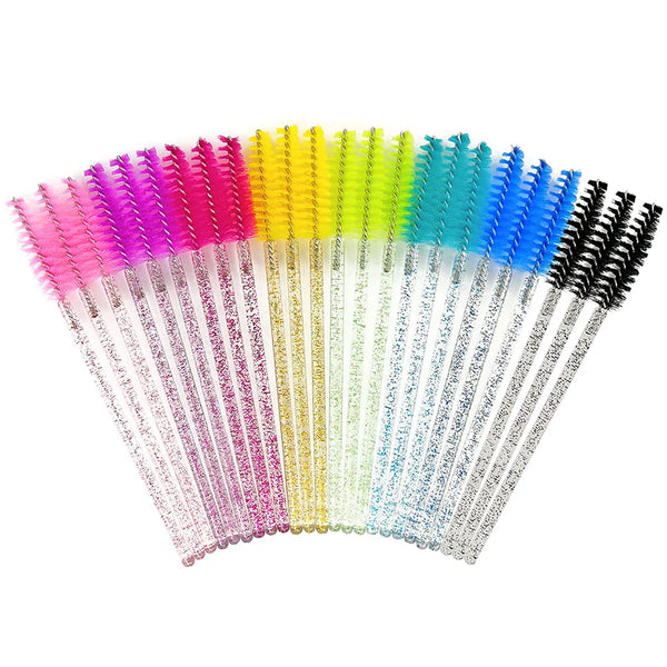 A collection of colorful disposable eyelash brushes arranged in a fan shape.