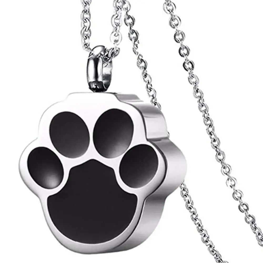 A silver stainless steel pet paw print necklace with a bail and chain.