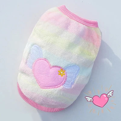 A pink and yellow fluffy fleece vest with a heart and butterfly design for small pets.