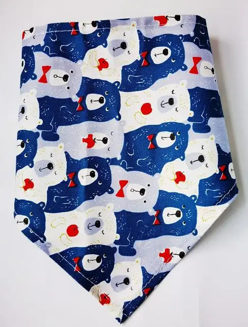 A fabric featuring cute blue and white bear faces in a repeating pattern for pet bandanas.