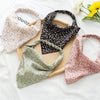 Three patterned fabric head scarves, including a floral pink one, a black patterned one, and a light pink patterned one, disp