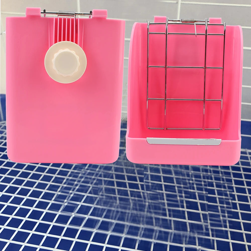 A pink rabbit hay and food rack with a wire grid and a circular opening sits on a blue grid surface.