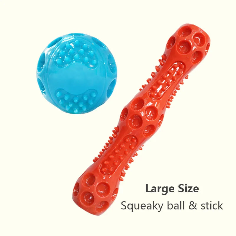 Pelota chirriante grande de color naranja y juguete de palo para perros