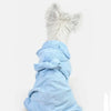 A fluffy white pet bath robe with a matching light blue hood and tie-back detail.