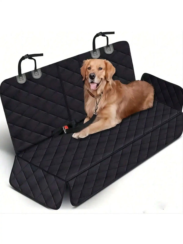A golden retriever dog is resting on a black quilted waterproof car seat cover with handles.