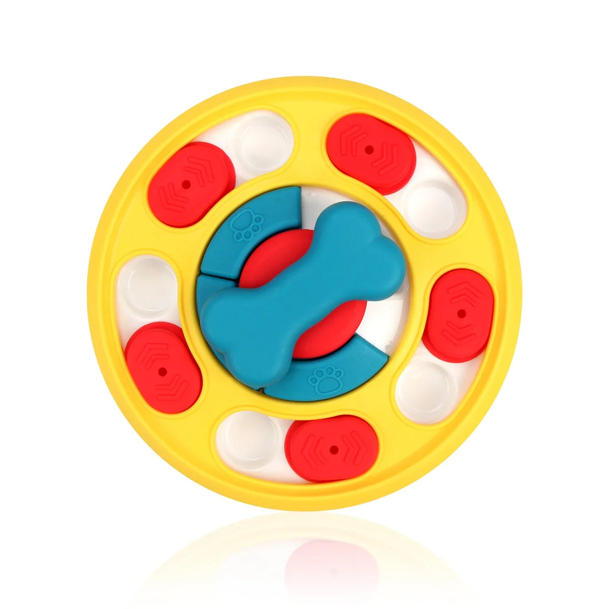 Yellow slow feeder bowl with multiple compartments containing red and blue silicone shapes for pets