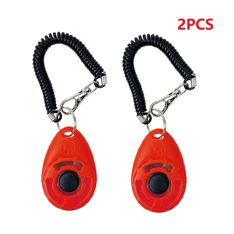 Zwei orange Pet-Trainings-Klicker-Armbänder mit schwarzen, gewickelten Schnüren und silbernen Schnallen