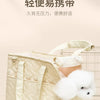 A light beige quilted portable pet carrier bag with light beige straps and a white fluffy toy is displayed on a neutral backg