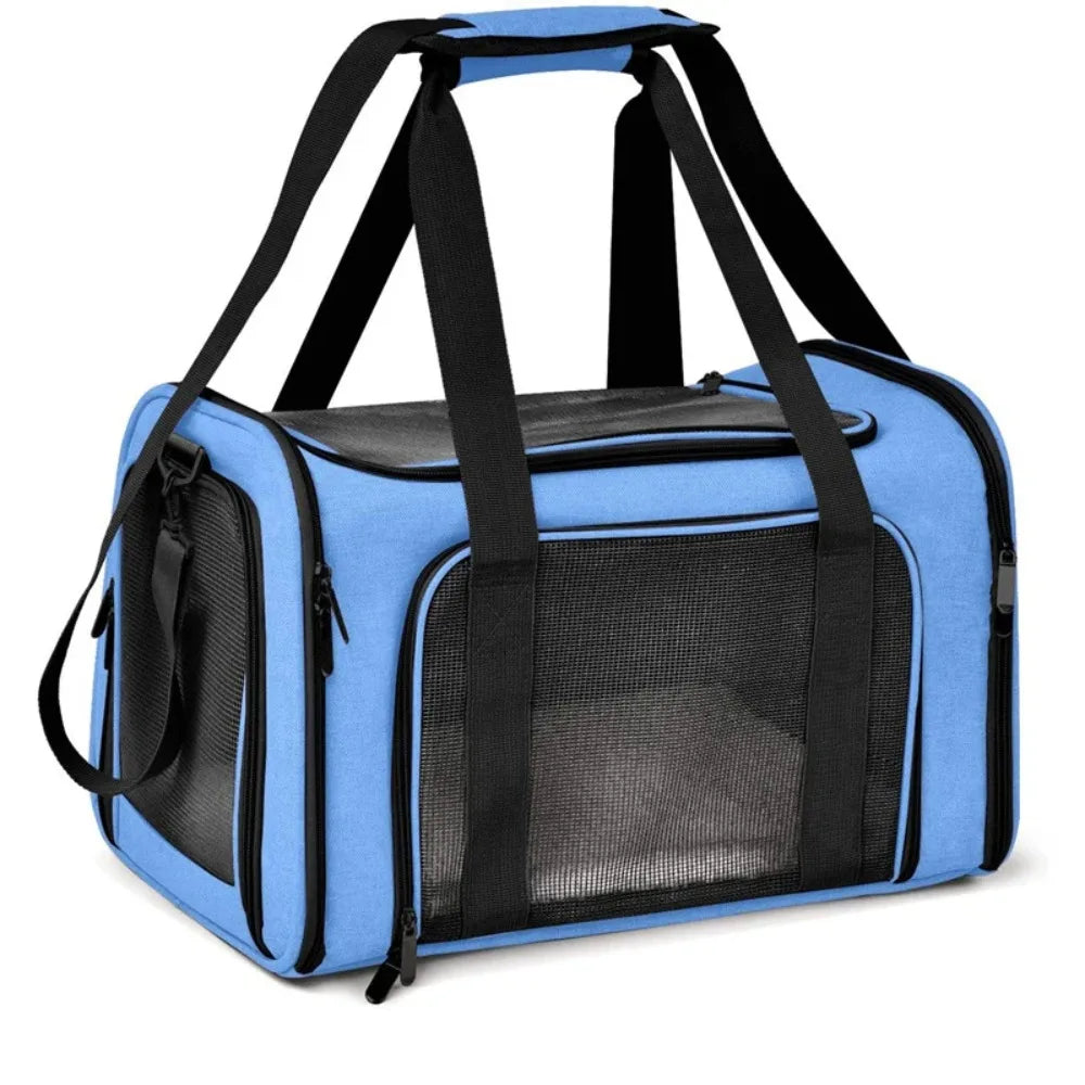 A light blue breathable pet carrier backpack with black straps and mesh window.