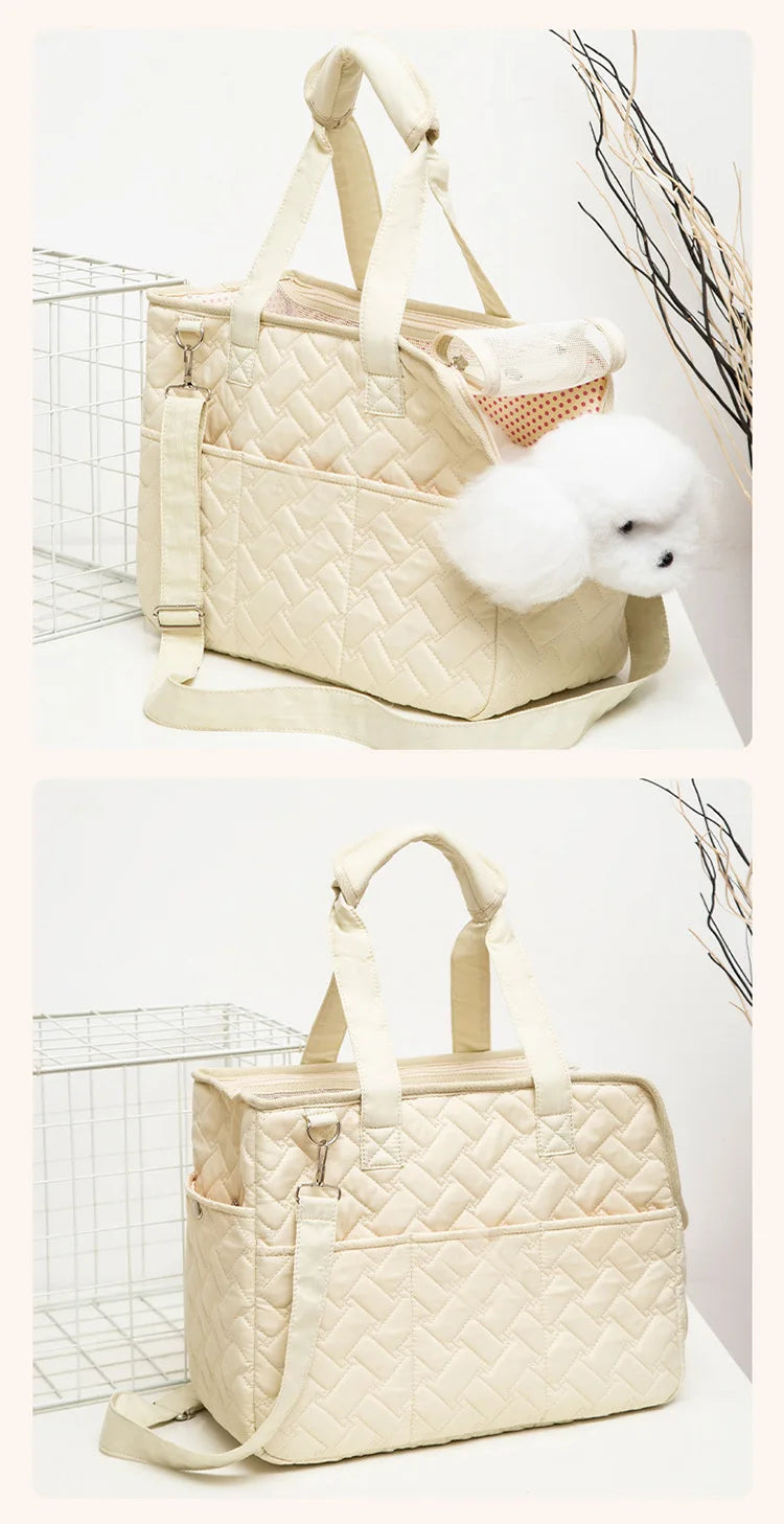 A beige quilted portable pet carrier bag with light beige straps and a white fluffy toy dog is displayed on a white surface.
